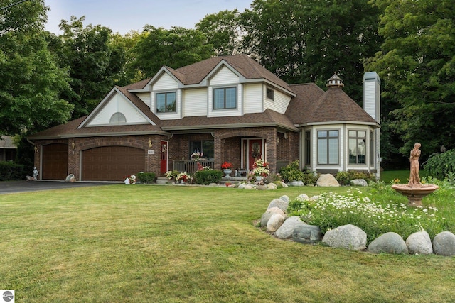 view of front of home with covered porch and a front yard