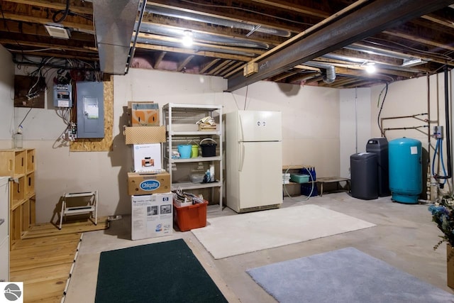 basement with white refrigerator