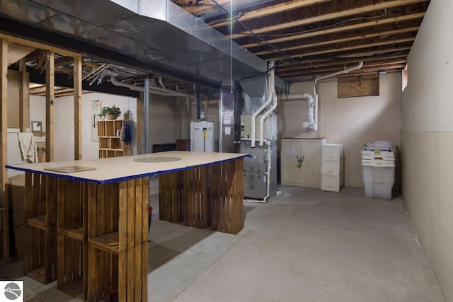 basement featuring heating utilities and gas water heater