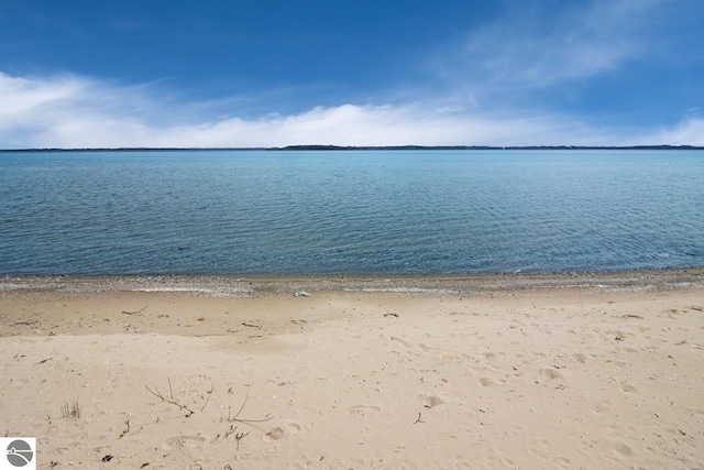 property view of water featuring a beach view