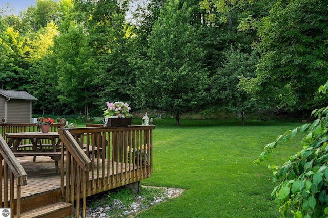 view of yard with a wooden deck