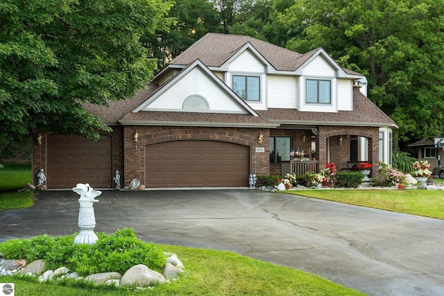 view of front of house featuring a garage and a porch