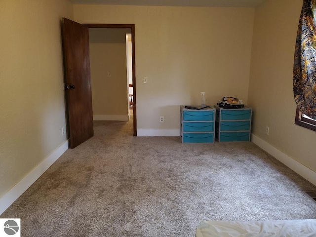 unfurnished bedroom with carpet floors