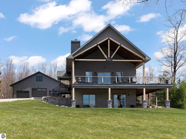 rear view of property with a wooden deck, a yard, and a garage