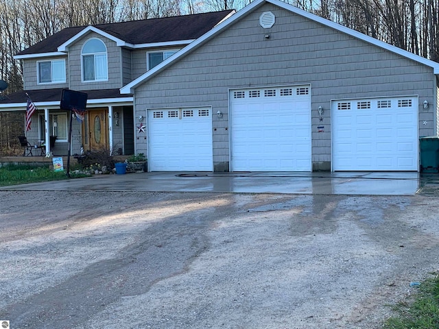 view of front of home with covered porch and a garage