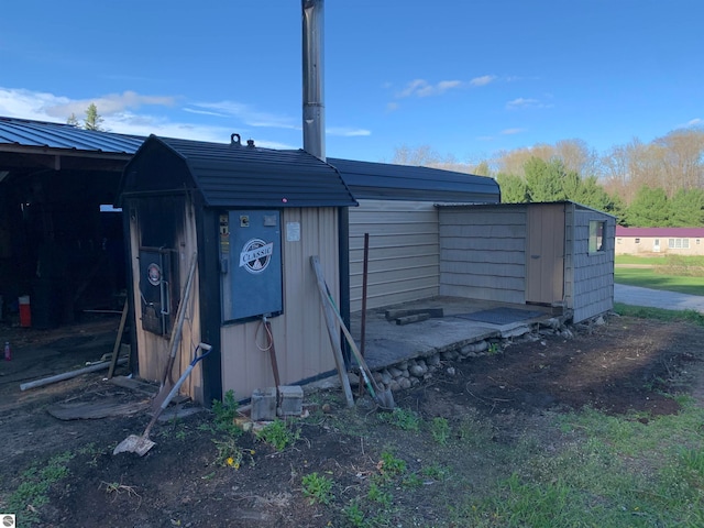 view of property exterior featuring a storage shed