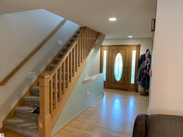 foyer entrance with wood-type flooring