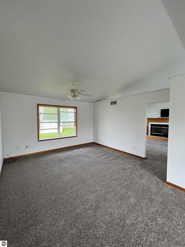 carpeted empty room with ceiling fan