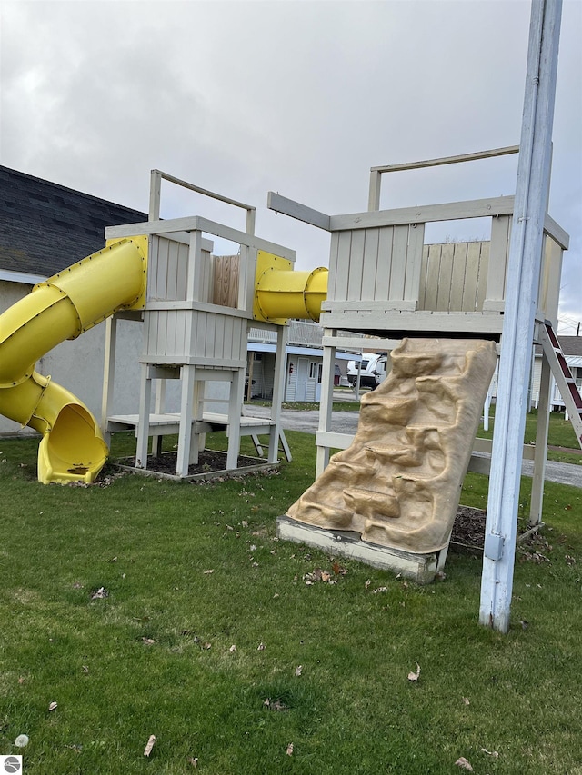 view of playground with a lawn