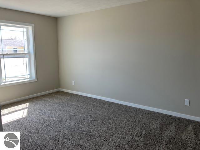 empty room with carpet flooring