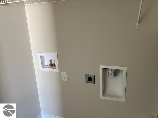 laundry room featuring electric dryer hookup and washer hookup