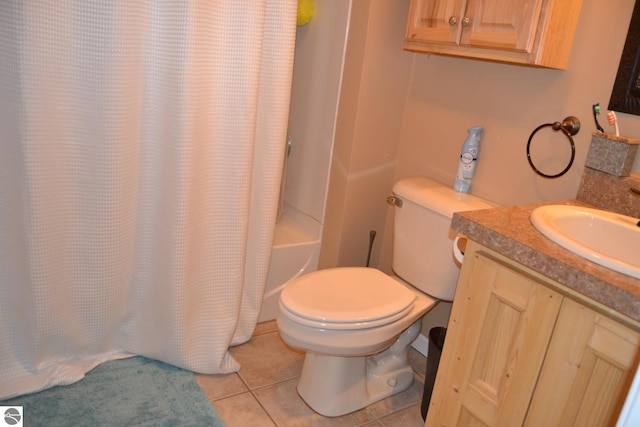 full bathroom with vanity, toilet, tile floors, and shower / bath combo with shower curtain