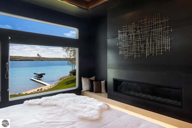 bedroom featuring a water view