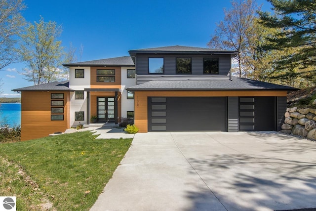 view of front facade featuring a garage and a front lawn