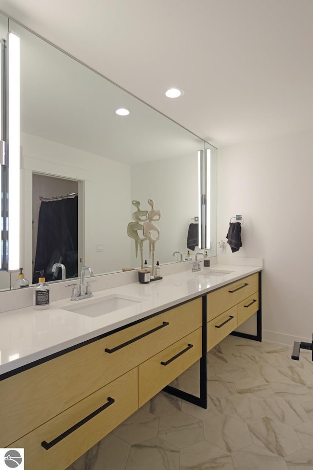 bathroom featuring double vanity and tile floors