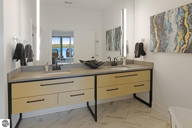 bathroom with double sink vanity and tile floors