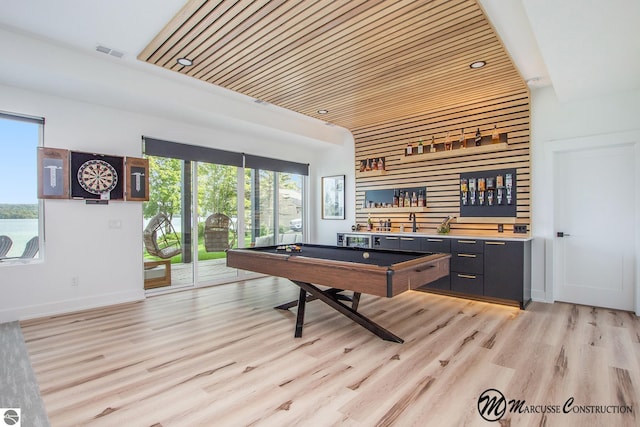 recreation room with wooden ceiling, light hardwood / wood-style flooring, indoor bar, and pool table