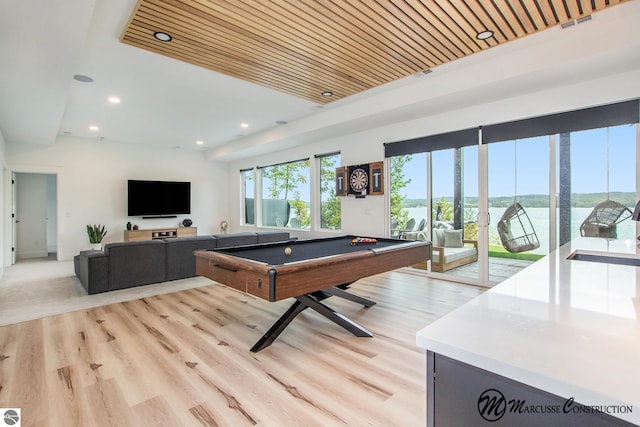 game room featuring wooden ceiling, light wood-type flooring, sink, and pool table