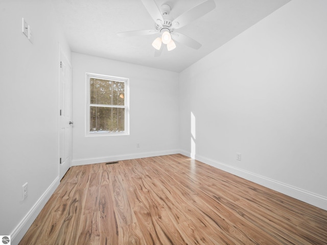 empty room with light hardwood / wood-style flooring and ceiling fan