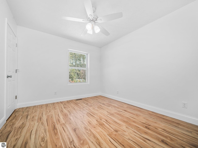 spare room featuring light hardwood / wood-style flooring and ceiling fan