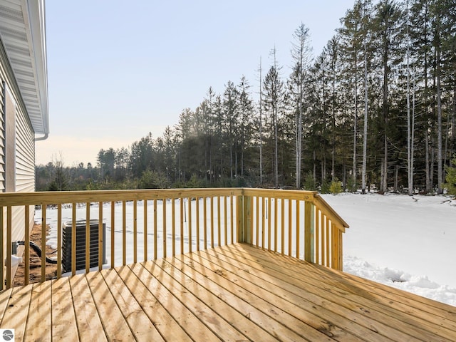 snow covered deck featuring central AC