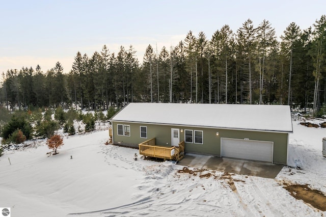 view of front of property with a garage and a deck