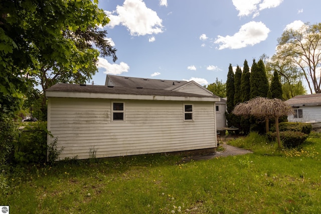 view of property exterior featuring a lawn