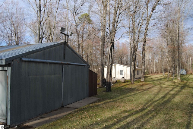 view of shed / structure with a yard