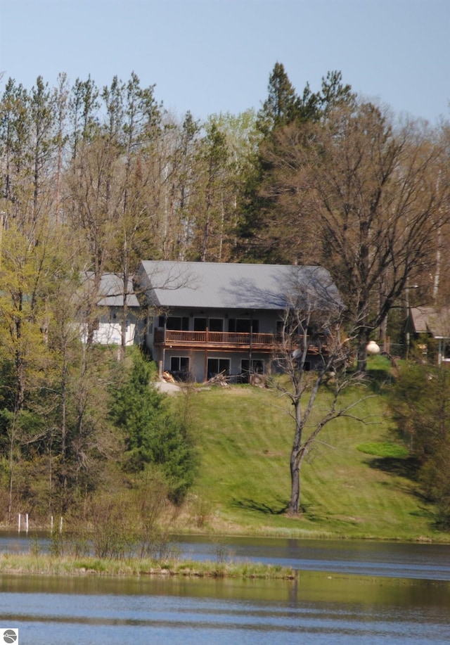 view of front of house featuring a water view