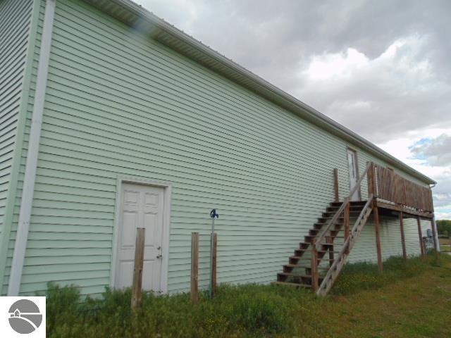 view of side of property featuring a deck