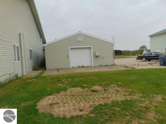 garage featuring a yard