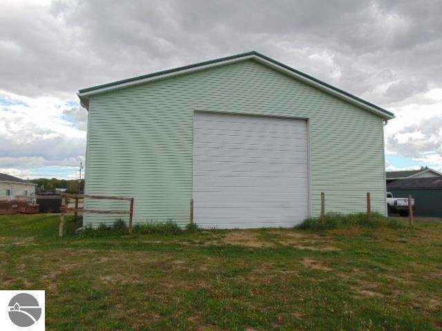 view of side of property featuring a yard