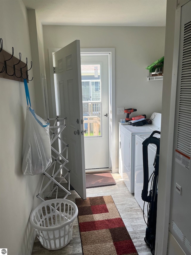 washroom featuring washer and clothes dryer and hardwood / wood-style floors