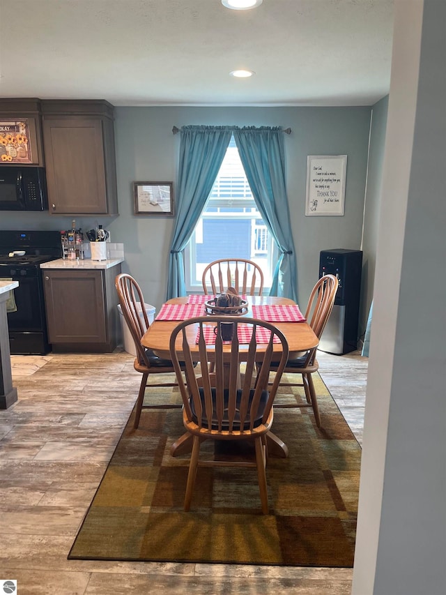 dining space featuring light hardwood / wood-style flooring