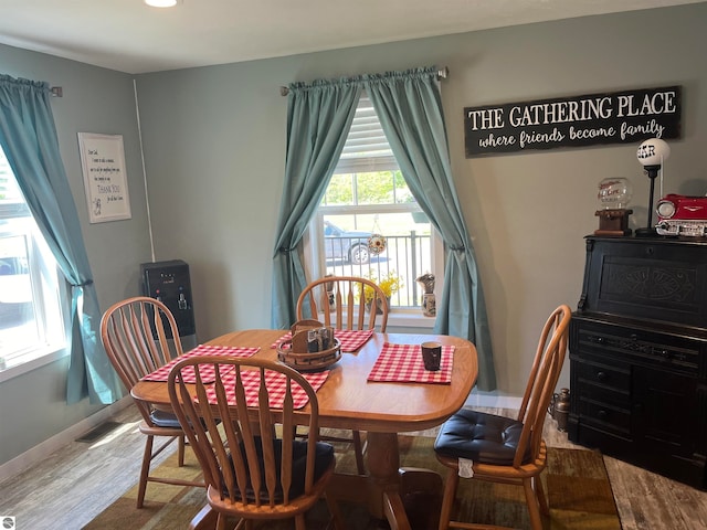 dining space featuring hardwood / wood-style flooring