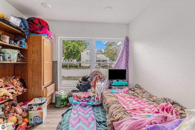 812 Forest Ave, Frankfort, MI 49635 - bedroom with light hardwood / wood-style flooring