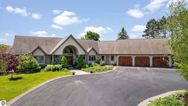 view of front facade with a garage and a front yard