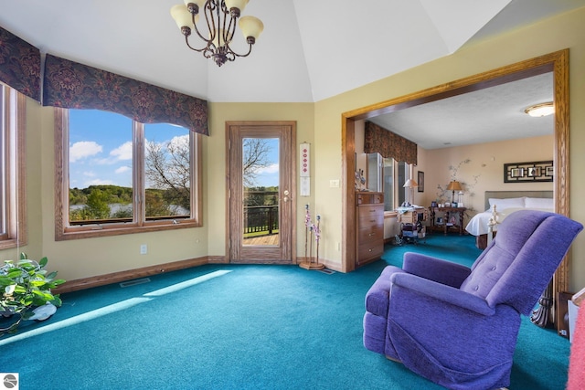 interior space with a chandelier, high vaulted ceiling, and carpet floors