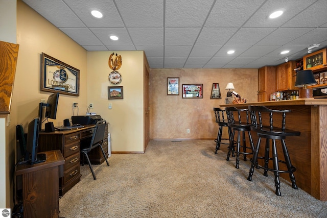 bar with carpet flooring and a drop ceiling