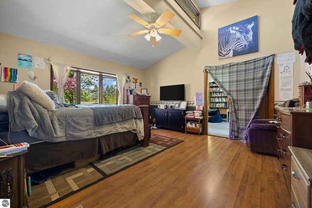 bedroom with high vaulted ceiling, ceiling fan, and hardwood / wood-style floors