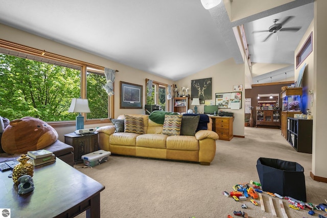 carpeted living room featuring high vaulted ceiling and ceiling fan