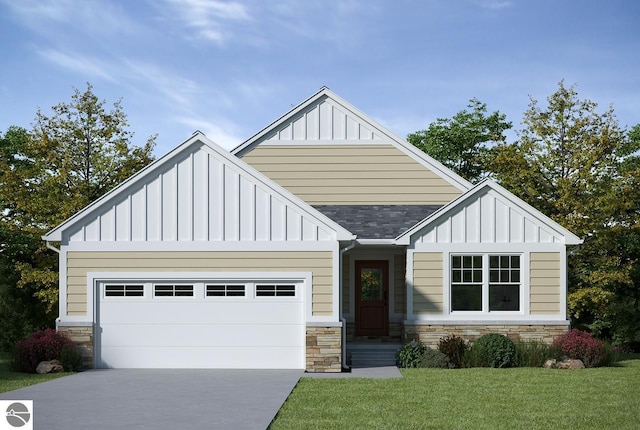 view of front of house featuring a front yard and a garage