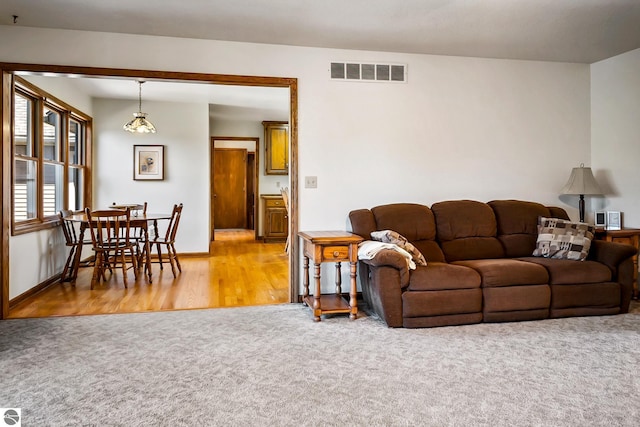 living room featuring light carpet