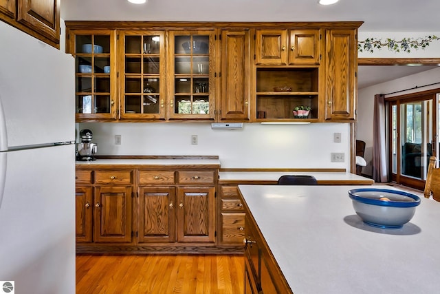 kitchen featuring white fridge and light hardwood / wood-style flooring