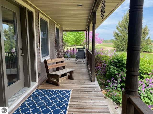 wooden deck featuring covered porch