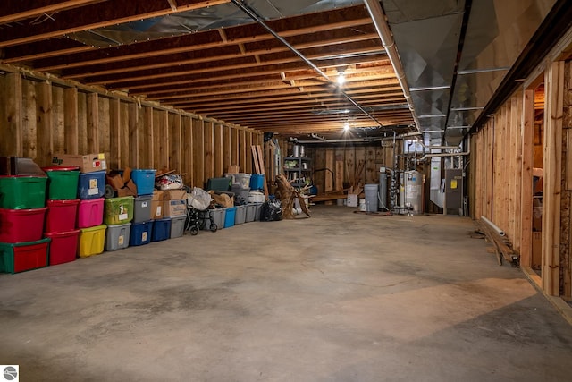 basement with heating unit and water heater