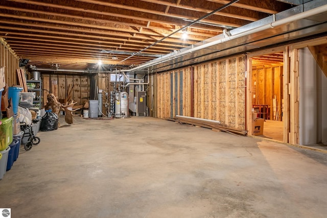 basement featuring heating unit and gas water heater