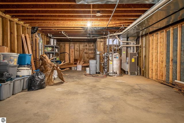 basement featuring heating unit and water heater