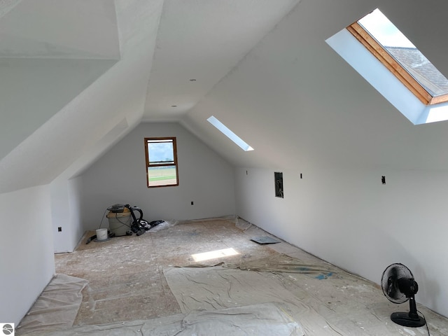 additional living space with lofted ceiling with skylight