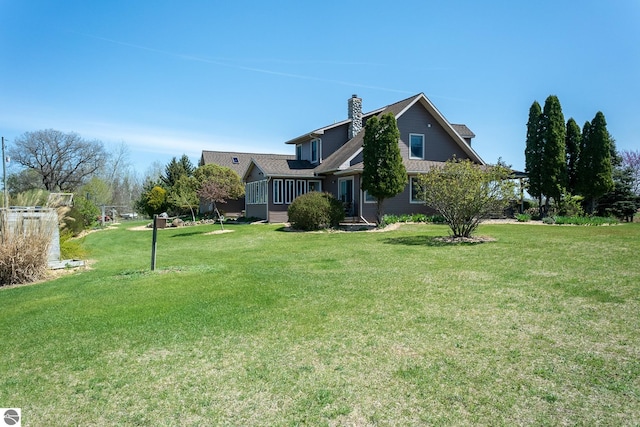 view of yard featuring a sunroom